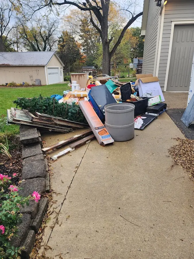 Dumpster being loaded with debris for Demolition Dumpster Rental in North Cornwall